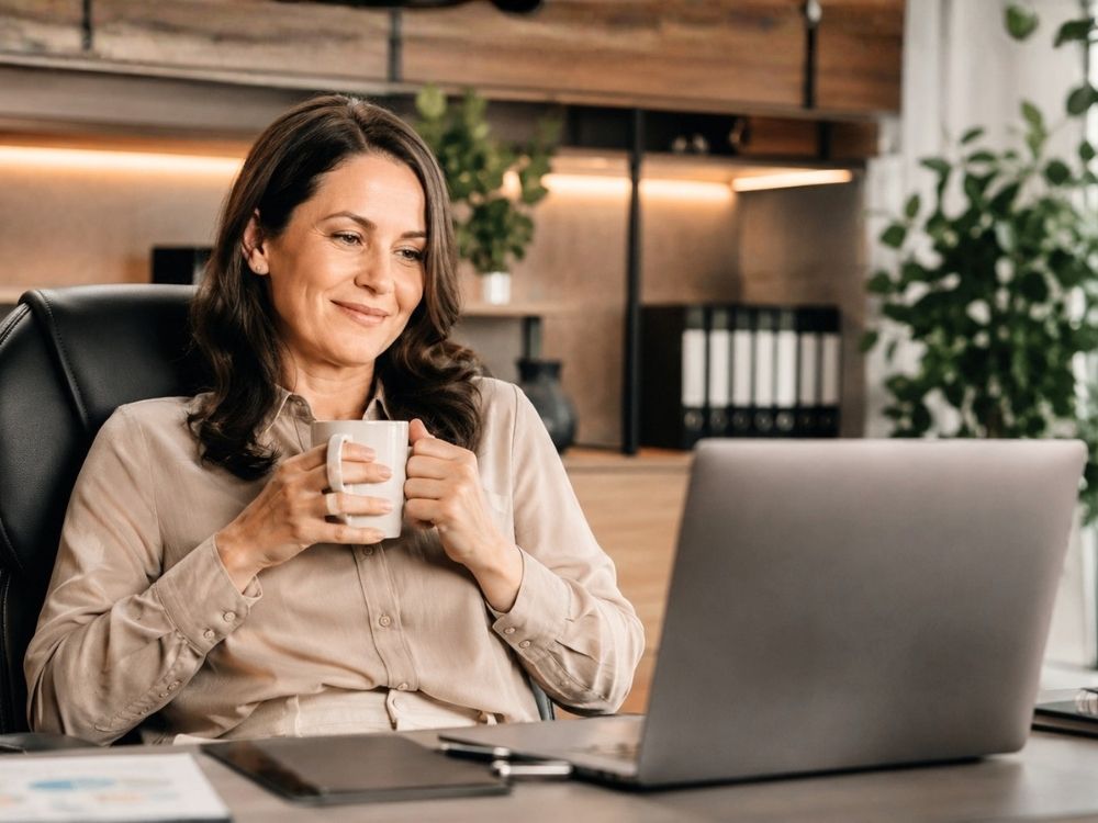 Satisfied HR manager using HR Command to manage workflow automation, ensuring repetitive tasks and compliance checks run effortlessly in the background.