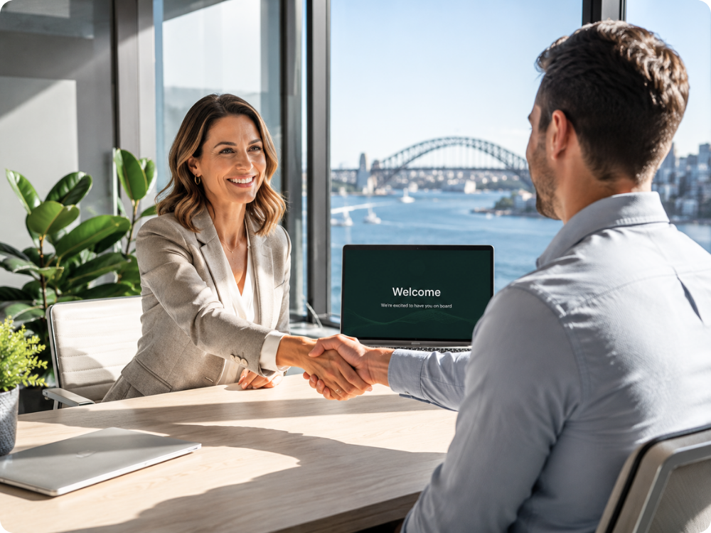 Professional HR manager welcoming a new hire to a Sydney office, illustrating a seamless employee onboarding process managed through HR Command.