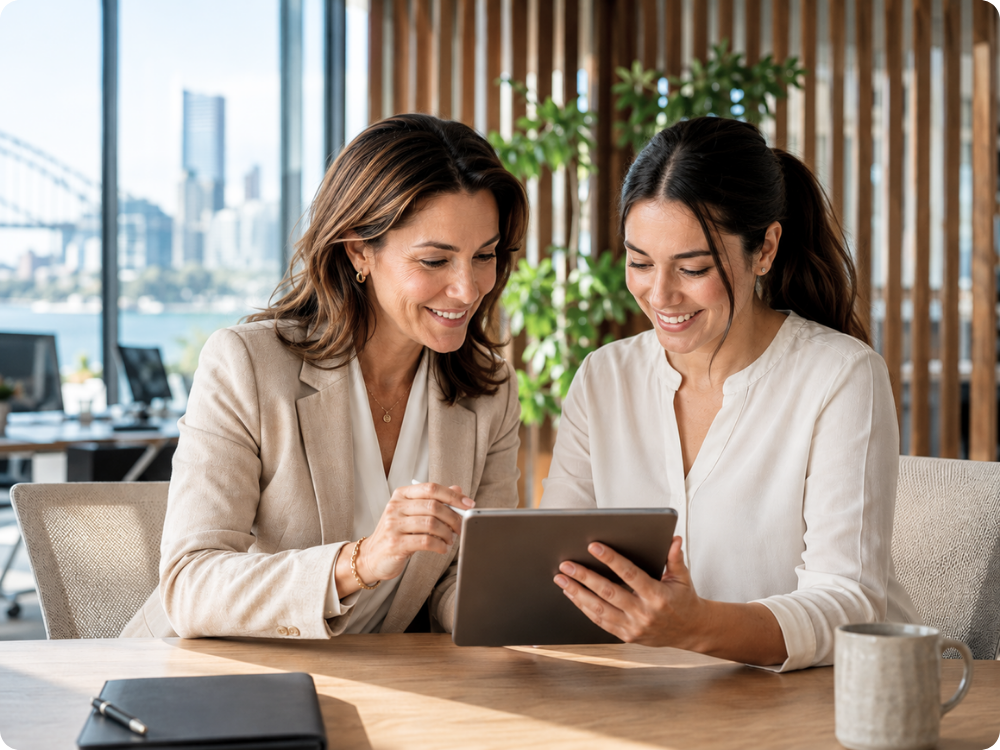 HR professionals in Sydney using HR Command to review and manage digital Position Descriptions on a tablet.