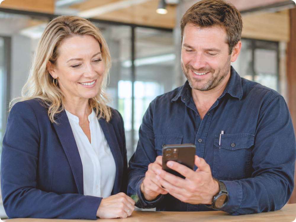 A supervisor and worker using HR Command on a smartphone to log a real-time hazard, demonstrating the simplicity of mobile-first WHS Management for site-based teams.