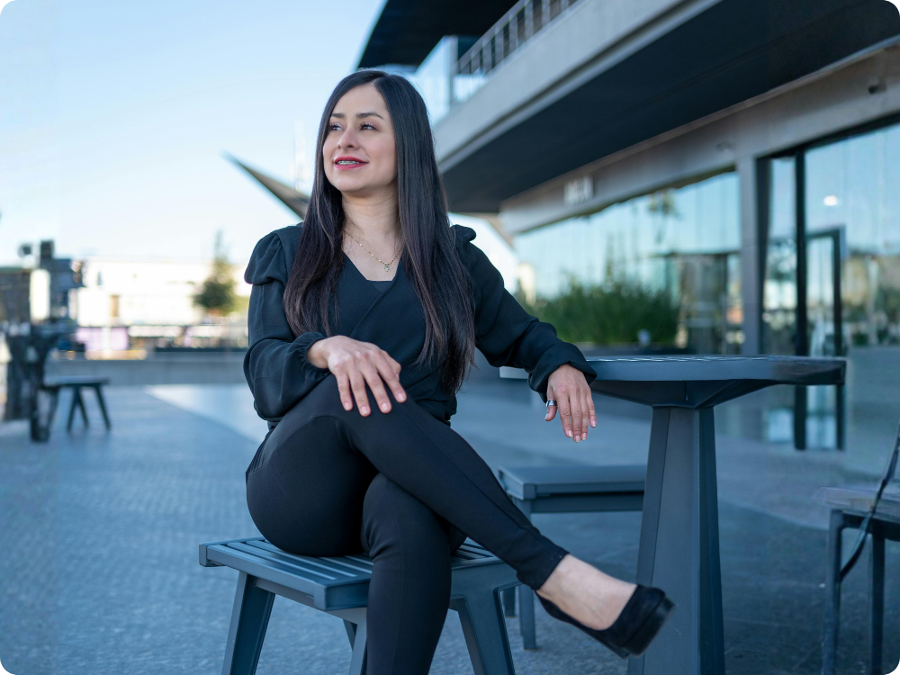 HR consultant sitting outside a modern building, representing lawyer-backed HR compliance software for Australian workforce specialists and HR professionals