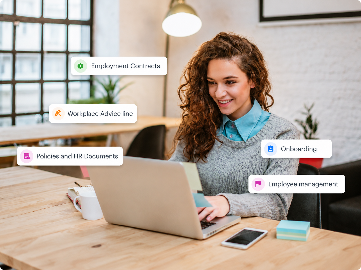 Woman using HR Command on a laptop to generate lawyer-drafted HR and WHS documents, policies, contracts and letters